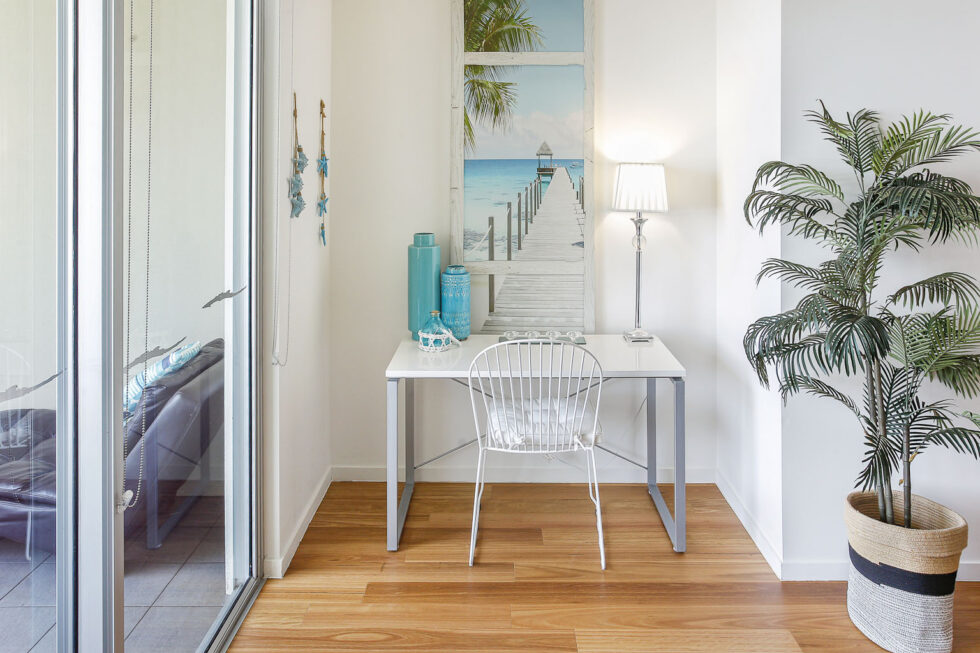 Pool View 2 Bedroom Apartment entry console beside balcony door