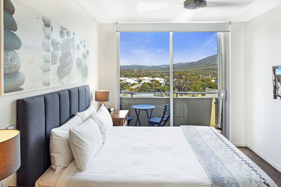 Pool View 2 Bedroom Apartment bedroom with balcony and hinterland view